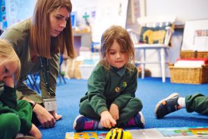 Pupil playing with Robotics