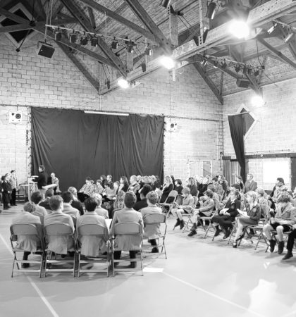 Crowd of People Sitting Down